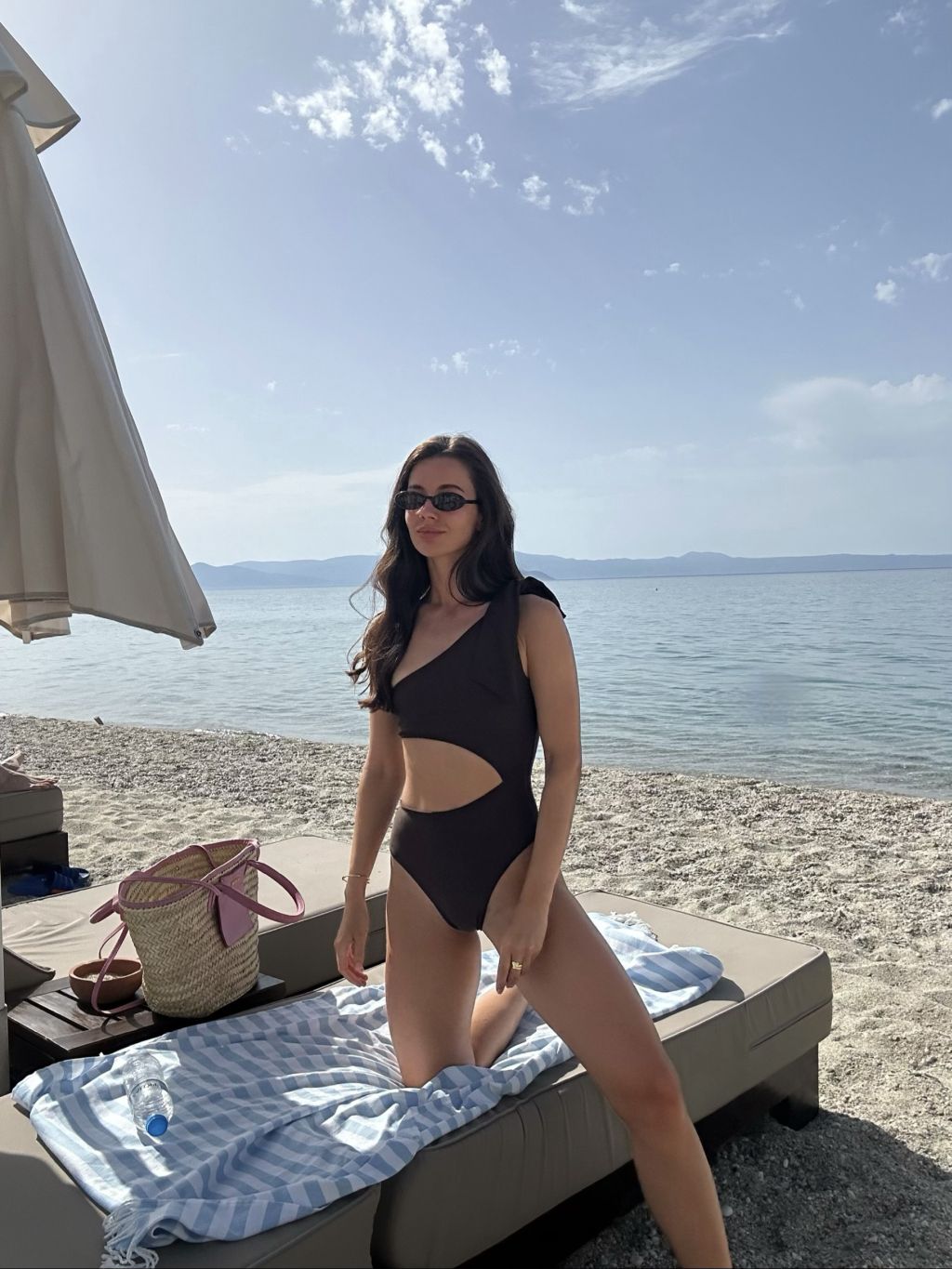 Elegant brown swimsuit with asymmetrical cut-out, beach fashion, summer swimwear