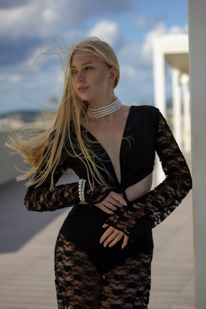 Long black lace beach dress – front view with plunge neckline
